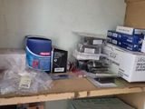 a shelf with a lot of boxes and other items on it