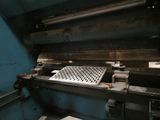 a machine that is working on a piece of metal
