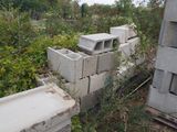 a pile of concrete blocks sitting in the middle of a field