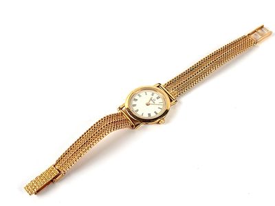 a close up of a gold wrist watch on a white background