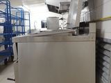 an image of a commercial kitchen with stainless steel appliances