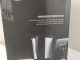 packaging of a coffee maker sitting on top of a white counter