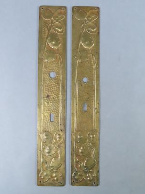 pair of antique brass door handles with flowers and birds