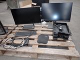 two computer monitors and a keyboard on a pallet