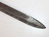 a small knife that is laying on a table