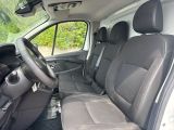 the interior of a van with the driver ' s seat folded down