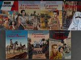books on a wall with pictures of women and men on them