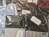 a lot of clothes that are sitting on a table