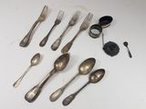 a lot of silver spoons and forks on the table