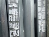 a close up of a metal door with a sticker on it