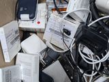 a cardboard box full of electronic devices and other items