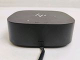 a small black device sitting on top of a white table