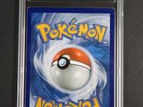 a close up of a pokemon card in a plastic case