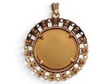 a close up of a gold pendant with pink stones on a white background