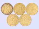 four gold coins with a picture of a man and a woman on them