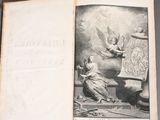 an old book with a picture of an angel on it