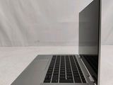 an open laptop computer sitting on top of a white surface
