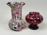 two vases sitting next to each other on a table