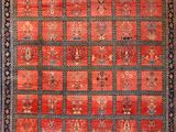 a red and blue rug with a pattern on it