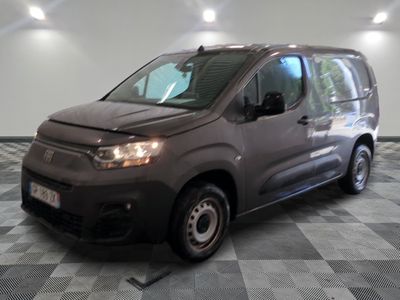 a picture of a grey van parked in a garage