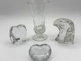 several pieces of glass sitting on a table next to each other