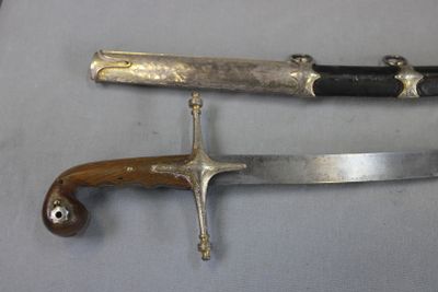two knives that are laying on a table
