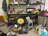 a garage with a lot of tools and tools on the floor