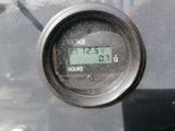 a close up of a digital clock on a motorcycle