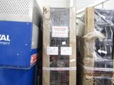 several boxes of electrical equipment in a storage room