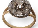 an image of a gold and diamond ring on a white background