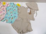 baby girl ' s clothing and hat on display on a table