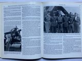 an open book with a picture of a group of men in military uniforms