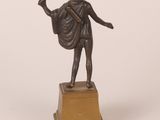 bronze statue of a man holding a shield and a shield on a pedestal