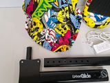 two skateboards and a skateboard holder on a table