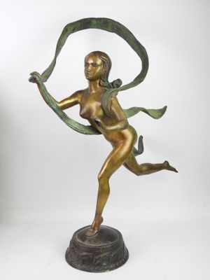 bronze statue of a woman holding a ribbon in her hand