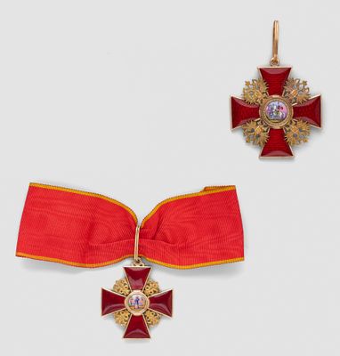 an image of a red ribbon with a gold cross and a red ribbon with a gold cross on it