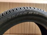 a close up of a tire on a table with a box in the background