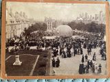 an old photo of a crowd of people standing around a large ball