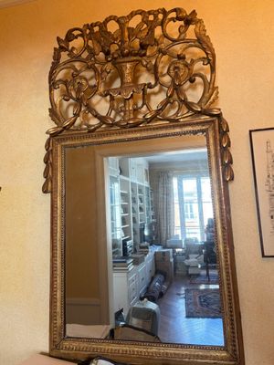 a mirror that is on the wall in the room