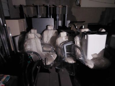 a bunch of chairs that are wrapped up and ready to be used