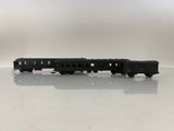 the toy train is sitting on the table on the white surface