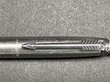 a pen that is laying on top of a table
