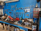 many tools on a workbench in a garage