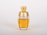 an image of a bottle of perfume on a white surface