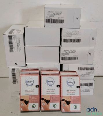 several boxes of skin care products stacked on top of each other