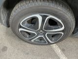 a close up of a tire on a car ' s rim