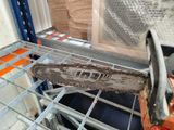 a chainsaw that is sitting on a shelf in a room