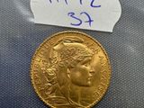 a close up of a gold coin with a price tag on it