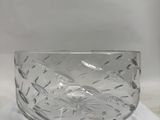 the glass bowl is sitting on top of a piece of paper
