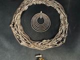 a necklace, bracelet, and ring with a tiger ' s eye stone
